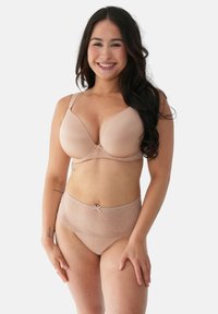 Nude bra and lace underwear set. Bra has soft cups, adjustable straps, and bow detail. Underwear features a lace trim and matching color.