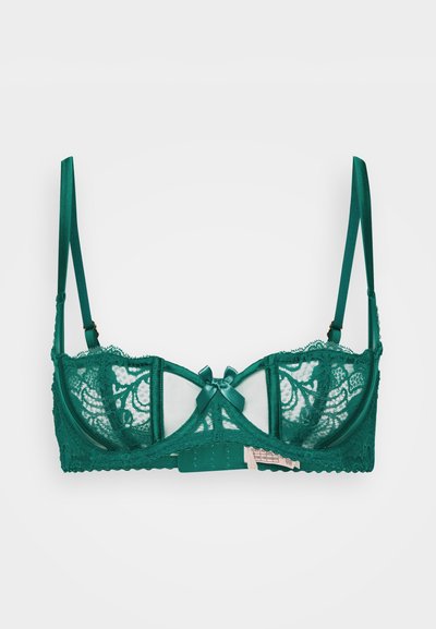 Green lace bra featuring soft mesh cups, satin straps, a decorative bow at the center, and adjustable back closures.