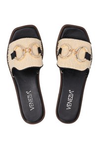 Open-toe slide sandals featuring a cream woven upper, black faux leather lining, and a gold chain accent across the strap.
