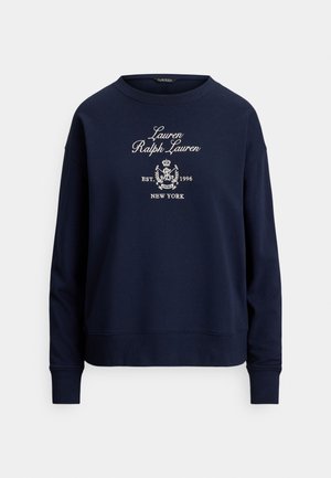 Laivastonsininen collegepaita, jossa on kirjailtu teksti "Lauren Ralph Lauren" ja vaakuna. Valmistettu pehmeästä kankaasta, pitkähihaiset ja resorit hihansuissa.