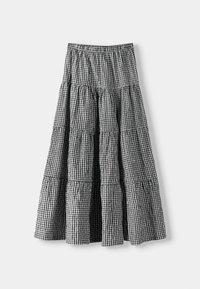 Mustavalkoinen ruudullinen kerroksellinen hame, jossa on joustava vyötärö ja pehmeä kangas. Hameessa on leveä design, joka mahdollistaa liikkumisen.