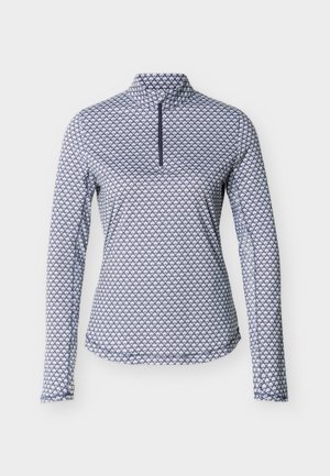 Pull-over à manches longues pour femmes avec un motif géométrique bleu marine et blanc, col montant, et fermeture à glissière à moitié frontale.