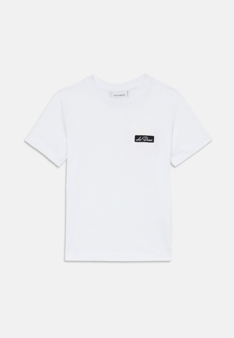 White cotton t-shirt with a crew neck, short sleeves, featuring a black rectangular logo patch on the left chest area. Flat texture.