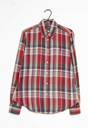 Camicia a quadri rossa e blu con maniche lunghe, colletto e orlo arrotondato. Realizzata in un tessuto morbido con una finitura texturizzata.