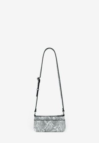 Small black and white snake print crossbody bag with a thin adjustable strap and zip closure. Textured finish and sleek design.