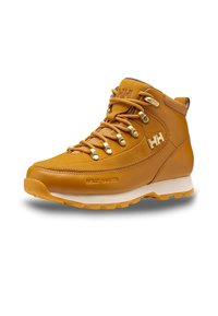 Braune Lederwanderstiefel mit goldenem Metall, strukturierten Schnürsenkeln, einem gepolsterten Schaftrand und einer robusten weißen Gummisohle. Mit Helly Hansen Branding.