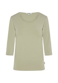 Three-quarter sleeve top made of soft, light green fabric. Features a round neckline and a straight hem. Tag on the side indicates brand.