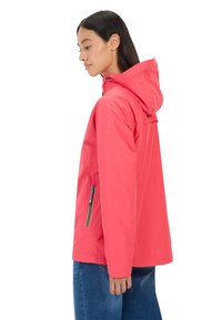 Pink rain jacket with a hood, featuring a zippered side pocket, lightweight fabric, and a loose fit. The design is simple and functional.