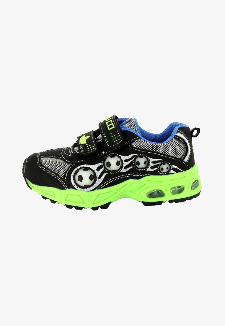 Black and neon green athletic shoe with mesh upper, soccer ball accents, two adjustable Velcro straps, and textured sole for grip.