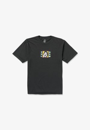 Camiseta de algodón negra con cuello redondo, con un gráfico colorido de una cara sonriente y el texto "VOL" y "GOM" dentro de un marco rectangular.