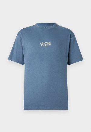 Blue cotton T-shirt featuring a round neck, short sleeves, and a central logo graphic in contrasting colors. Smooth texture and relaxed fit.