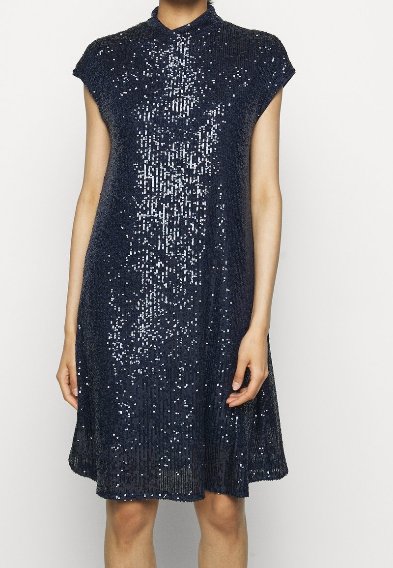 Navy blue sequined dress with a mandarin collar and cap sleeves, featuring a flared silhouette and a textured, shimmering surface.