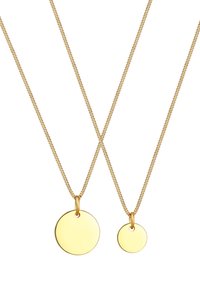 Goldene Halsketten mit runden, polierten Anhängern in zwei Größen. Die Ketten sind gedreht und zart, was die glänzenden Anhänger ergänzt.