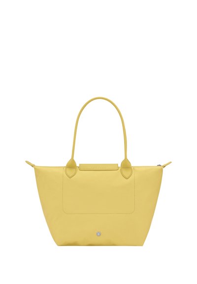 Yellow tote bag with two long handles, a front pocket, and a top zipper closure, displayed against a plain white background.