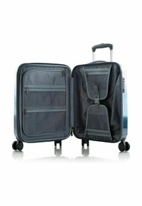 Cabin suitcase in blue faded design, featuring interior zippered pockets, mesh compartments, and adjustable straps; mounted on 4 wheels.