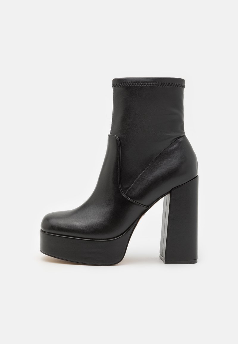 Black ankle boot made of smooth leather, featuring a high block heel and platform sole, with a rounded toe and elastic side panel.