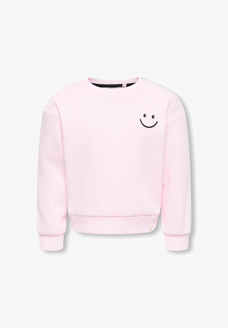 Sweat-shirt rose clair à manches longues avec poignets et ourlet côtelés, ornée d'un petit motif smiley noir sur le haut gauche de la poitrine.