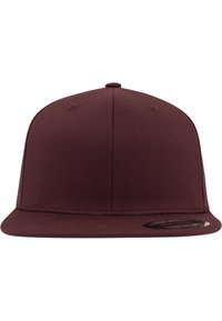 Maroon snapback cap with a flat brim, made from textured fabric. Features a rounded top and a glossy logo patch on the visor.