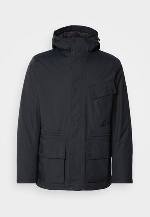 Black, insulated jacket with a detachable hood, two large front pockets, and a zippered chest pocket. Features button and snap closures.