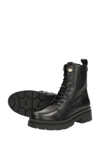 Schwarze Leder-Stiefeletten mit strukturiertem Obermaterial, Schnürdesign, runder Zehenform und dicker Gummisohle mit sechseckigem Profil.