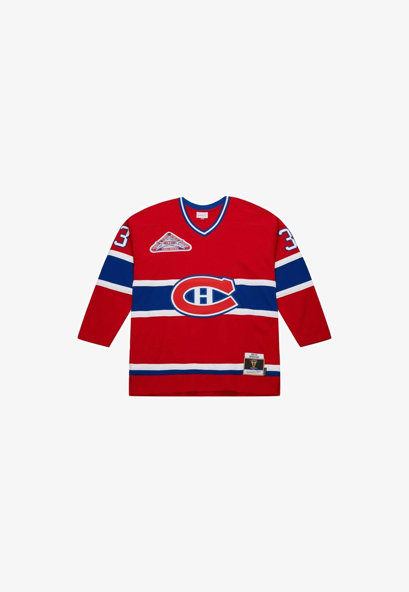 Red Montreal Canadiens hockey jersey with blue and white stripes, number 33 on sleeves, and team logo on chest and shoulder.