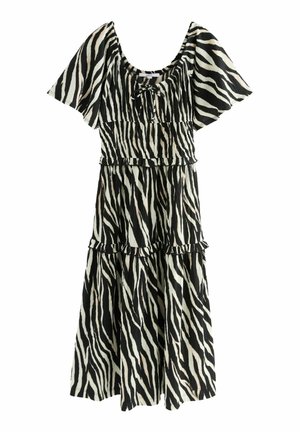 Robe midi imprimé zèbre noir et blanc avec manches courtes bouffantes, taille froncée, détails volantés et encolure carrée avec un lien à l'avant.