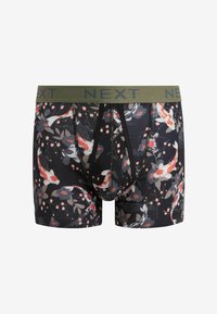 Black boxer shorts with a colorful koi fish and floral pattern. Features a green waistband with "NEXT" printed in blue. Soft, stretchy fabric.