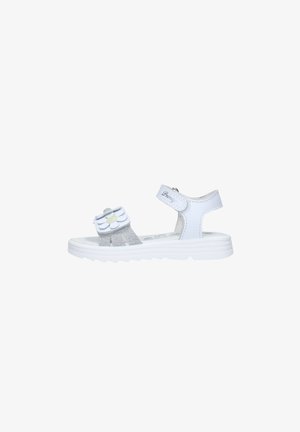 Sandalo bianco per bambini con cinturini glitterati, chiusura in velcro, decorazione con margherita e suola bianca spessa.