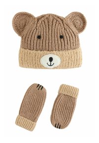 Bonnet tricoté et mitaines, marron avec oreilles et visage d'ours. Le bonnet a un bord beige clair; les mitaines ont une texture côtelée et des détails de griffes noires.