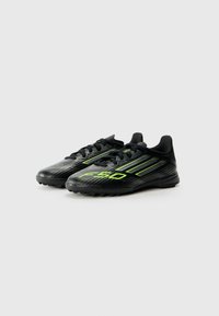 adidas Performance F50 LEAGUE UNISEX - Chaussures de football sur gazon - core black/iron/lucid lemon