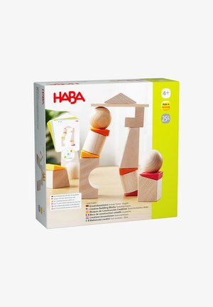Holzset mit kreativen Bausteinen, Bällen und Orangenscheiben zum Balancieren und Stapeln, geeignet für Kinder ab vier Jahren.