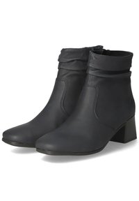 Black leather ankle boots with a slouchy upper, rounded toe, and a low block heel. Features minimal stitching and a smooth texture.