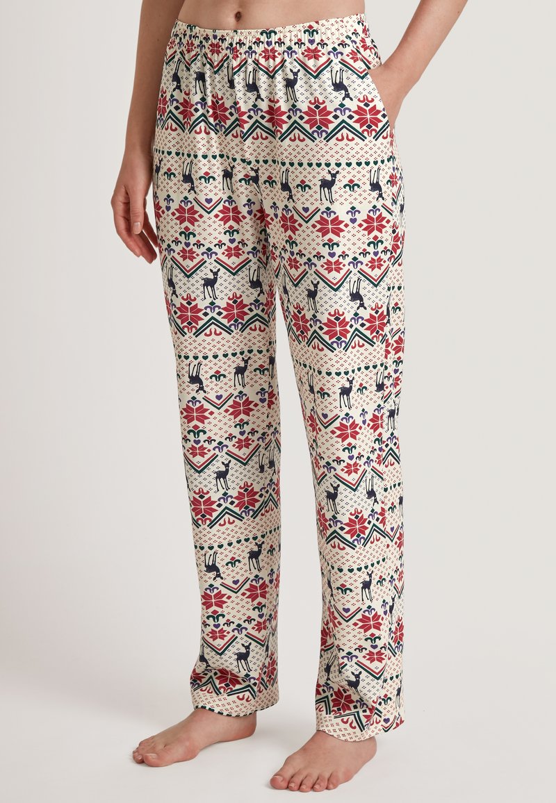 Katoenen pyjamabroek met een crèmekleurige achtergrond, versierd met een meerkleurig geometrisch en bloemmotief, en deermotieven door het hele ontwerp.