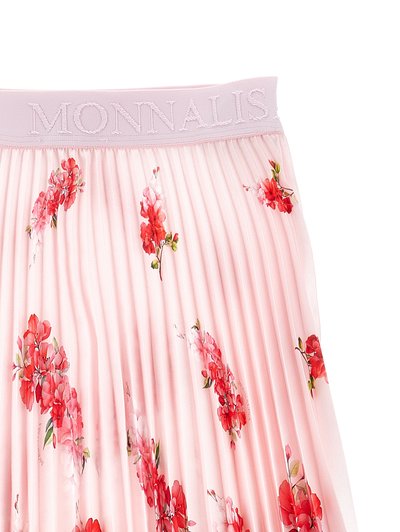 Ροζ πλισέ φούστα με κόκκινα λουλουδάτα σχέδια και φαρδιά μέση κεντημένη με τη λέξη "MONNALISA" σε ροζ νήμα που ταιριάζει.