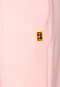 Nike Performance HERITAGE PANT - Calças de fato de treino - bleached coral
