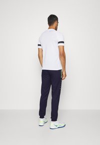 JAKO ALLROUND - Jogginghose - marine/neongelb