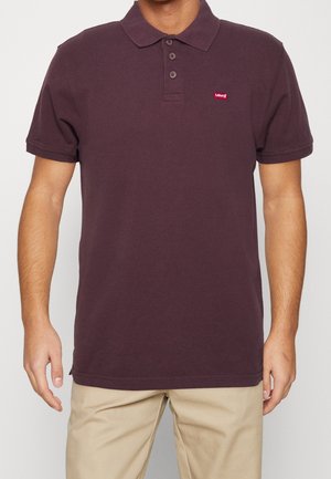 Vínová bavlněná polo košile s klasickým límečkem, tříknoflíkovou légou a malým červeným logem Levi's na levém prsu.