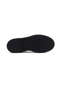 Semelle en caoutchouc noir avec surface texturée, bout arrondi et léger talon. Design simple sans motifs ni matériel supplémentaire.