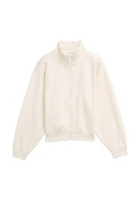 Veste blanche zippée avec un col montant, texture côtelée, épaules tombantes et poignets et ourlet élastiques. Design simple et minimaliste.