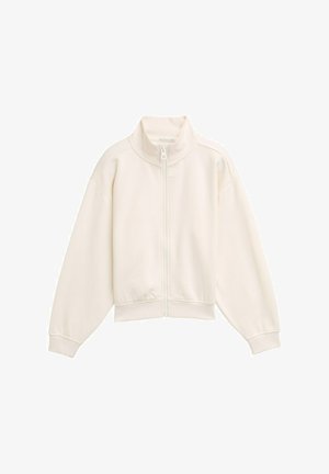 White zip-up jacket with a high collar, ribbed texture, dropped shoulders, and elasticized cuffs and hem. Simple, minimalist design.