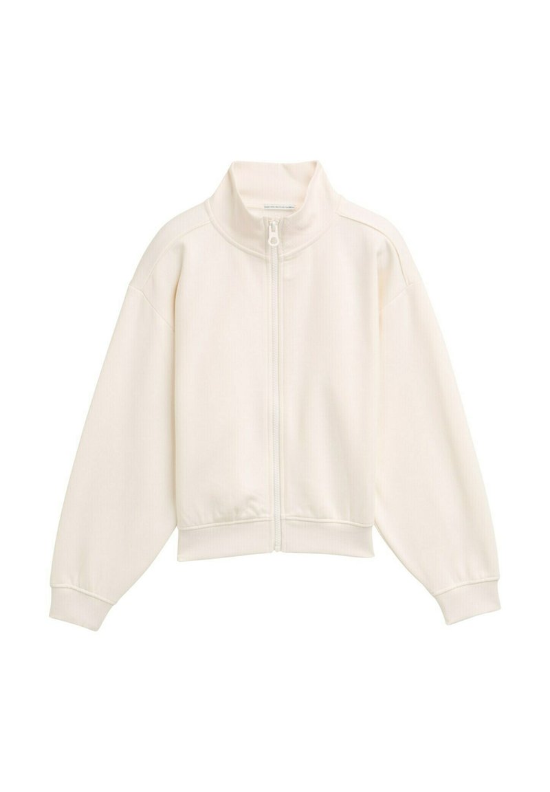 Veste blanche zippée avec un col montant, texture côtelée, épaules tombantes et poignets et ourlet élastiques. Design simple et minimaliste.