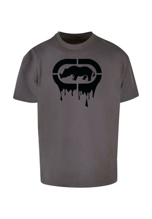 Gray cotton T-shirt featuring a large black graphic of a rhino with dripping paint effect. Short sleeves, crew neck design.