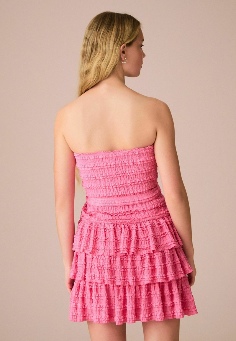 Next BANDEAU RUFFLE TEXTURED TIE WAIST MINI - Cocktail dress / Party dress  - bright pink/pink - Zalando