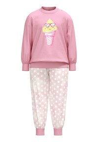 Roze sweatshirt met een ijsje graphic, gecombineerd met lichtroze sweatpants met stippen. Gemaakt van zachte stof, met ribbels aan de manchetten.