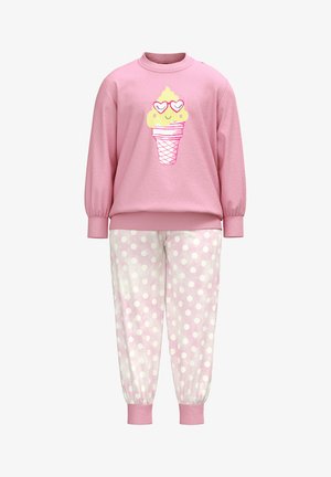 Pink sweatshirt with an ice cream graphic, paired with light pink polka dot sweatpants. Made from soft fabric, featuring ribbed cuffs.