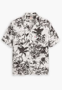 Camicetta a maniche corte bianca e nera con un motivo floreale tropicale caratterizzato da ibischi e palme, realizzata in tessuto leggero.