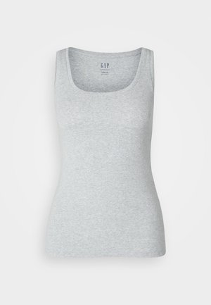 Halljadest valmistatud pehme puuvillane hall vooderdatud tank top. Omab ümmargust kaelust ja laia õlavarre rihma. Kaeluse taga on silt, kus on kirjutatud "GAP."