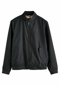 Veste noire à fermeture éclair avec col montant, deux poches latérales, fermeture par bouton au col et logo brodé discret sur la poitrine gauche.
