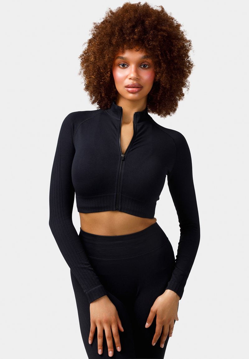 Black cropped athletic zip-up jacket with long, ribbed sleeves and a fitted design, made from smooth, stretchy material.