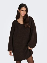 Brown oversized knit sweater dress with a round neckline and long sleeves. Textured fabric and ribbed hem detail.